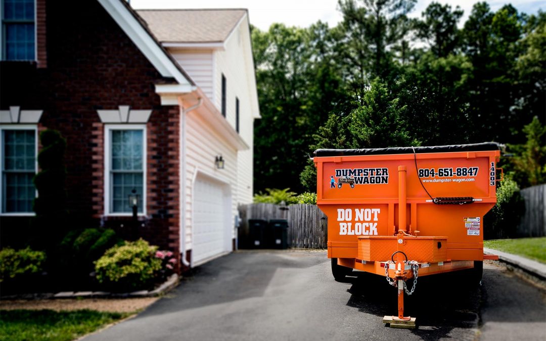 Homeowner with a Waste Dumpster Rental from Dumpster Wagon