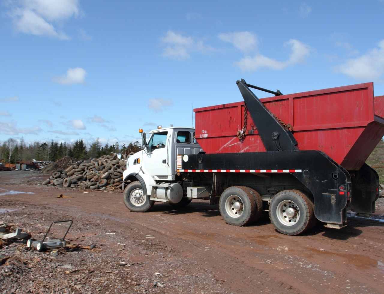 Waste Dumpster Rental Delivery in Progress